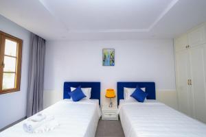 Postel nebo postele na pokoji v ubytování Rose Hotel Phú Quốc