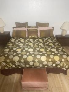 a bedroom with a bed with a polka dot bedspread at 4 Bedroom Home-Casino-State Farm Stadium only 2 Miles in Glendale +20 photos