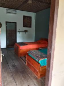 Ein Bett oder Betten in einem Zimmer der Unterkunft C Point Krui