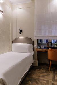 Postel nebo postele na pokoji v ubytování Hotel Smeraldo