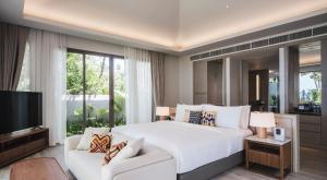 Postel nebo postele na pokoji v ubytování Avani Plus Khao Lak Resort
