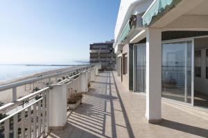 a balcony with a view of the beach at LIDER, 12º-A Atico in Cullera