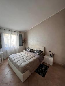 a bedroom with a large bed in a room at CASA DEPAU in Tertenìa