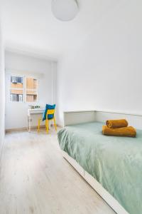 Postel nebo postele na pokoji v ubytování Home2Book Design Cool Center Apt Las Palmas