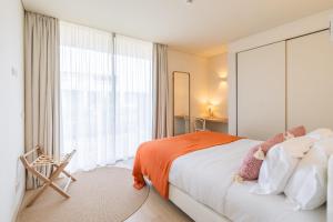 Кровать или кровати в номере White Shell Beach Villas