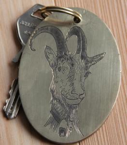 a key chain with a picture of a goat on it at Haus am Rain in Partenen