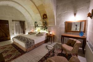 Postel nebo postele na pokoji v ubytování Mesken Cave Suites