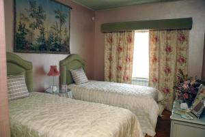 Postel nebo postele na pokoji v ubytování Casal Santo Antonio + 3 fotografie