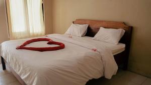 Säng eller sängar i ett rum på Indonesia Backpacker Hostels