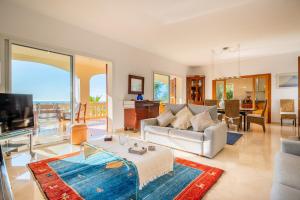a living room with a view of the ocean at Villa Bendinat 10 - by Priority Villas in Portals Nous