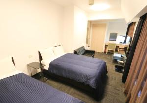 TV a/nebo společenská místnost v ubytování HOTEL LiVEMAX BUDGET Shinbashi