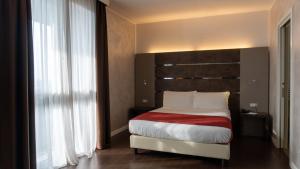 Postel nebo postele na pokoji v ubytování CAVALLO Hotel Noventa di Piave