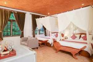 a bedroom with two beds and a living room at Gayatri in Ubud +280 photos