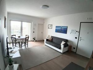 a living room with a couch and a table at Boulevard Suite in Bari