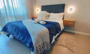 Ένα ή περισσότερα κρεβάτια σε δωμάτιο στο Blueviews Deluxe at Brookes Hill Suites