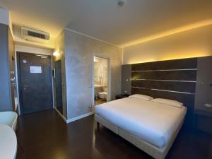 Postel nebo postele na pokoji v ubytování CAVALLO Hotel Noventa di Piave