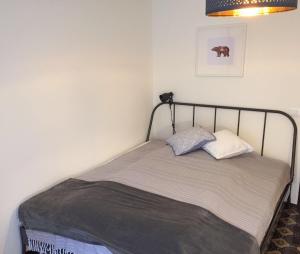 a bed with two pillows on it in a room at Lavinia in Oggebio +20 photos
