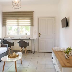 a living room with a couch and a table at Hotel Papanikolaou in Ierissos