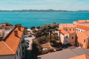 an aerial view of a city and the ocean at Apartments & Rooms Andrea in Zadar