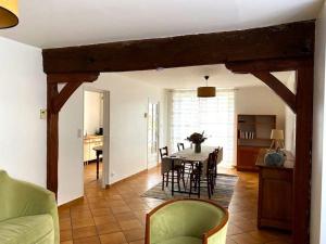 a kitchen and dining room with a table and chairs at Gîte Saint Pierre in Verdigny