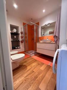 a bathroom with a toilet and a sink and a shower at Casa ORRI by Farris & Cors in Genoa