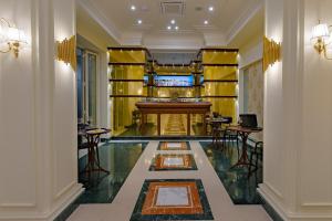 a lobby of a hotel with a bar at La Paloma Blanca Hotel in Sciacca