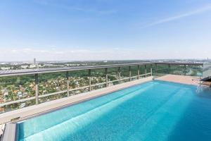 a swimming pool on top of a building at Design apartment with amazing view over Vienna in Vienna