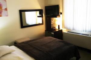 Łóżko lub łóżka w pokoju w obiekcie Hotel Astory Plzeň
