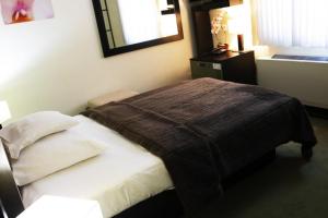 Łóżko lub łóżka w pokoju w obiekcie Hotel Astory Plzeň