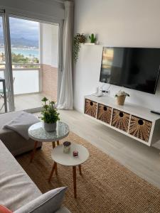 a living room with a large flat screen tv at Duque Mar 1, Torre del mar - HOME RENT MALAGA in Torre del Mar +26 photos