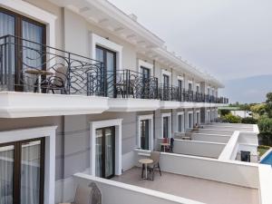 an external view of a building with balconies at Danai Hotel & Spa in Olympic Beach