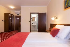 Postel nebo postele na pokoji v ubytování Hotel Continental