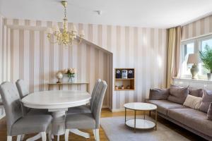 a living room with a table and a couch at Best Western Malmia Hotel in Skellefteå