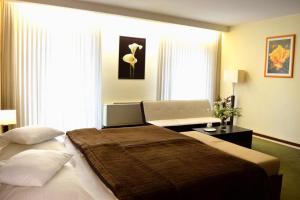 Łóżko lub łóżka w pokoju w obiekcie Hotel Astory Plzeň