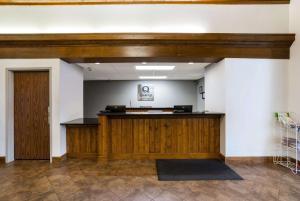 a lobby with a reception desk in a building at Quality Inn & Suites in Monterey