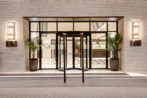 an entrance to a building with a revolving door at Lemon Tree Premier, Mumbai International Airport in Mumbai