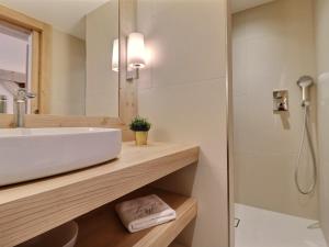 a bathroom with a white sink and a shower at Chalet Morzine, 7 pièces, 12 personnes - FR-1-627-20 in Morzine