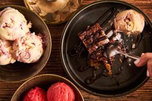 a table with two plates of desserts with ice cream at The Old Success Inn in Sennen Cove