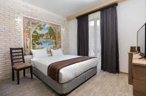 Postel nebo postele na pokoji v ubytování Alaska Resort + 37 fotografií