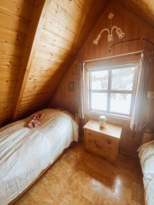 Säng eller sängar i ett rum på Hvammur Cottages
