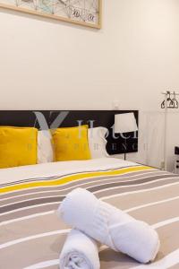 a bedroom with a bed with towels on it at AYZ Villegas - Auto check-in property in Madrid