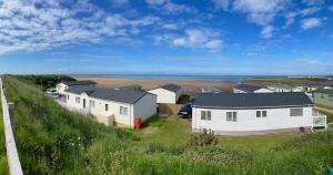 a row of houses on the side of a hill at LA07 Oceanview in Morecambe