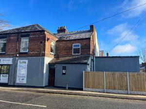 a house on the side of a street at Luxury 2 bed Apartment in Stoke-on-Trent in Stoke on Trent