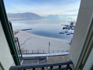 a view from a window of a harbor with boats at Bellavista in Feriolo in Baveno