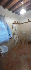 a bathroom with a white toilet and a sink at Villa Nobile Cortona B&B in Cortona