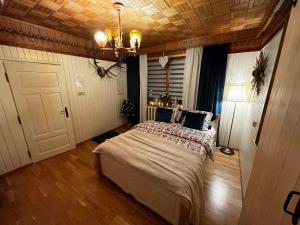 Posteľ alebo postele v izbe v ubytovaní Apartamenty na Galicówce