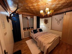 Posteľ alebo postele v izbe v ubytovaní Apartamenty na Galicówce