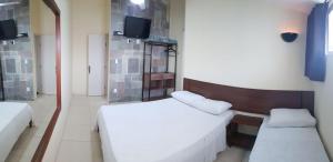 Sleep Suites客房内的一张或多张床位
