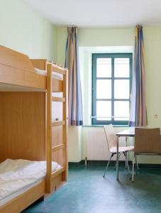 Cama ou camas em um quarto em Jugendherberge Wien - Myrthengasse