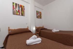 Ein Bett oder Betten in einem Zimmer der Unterkunft Virginia Apartment
